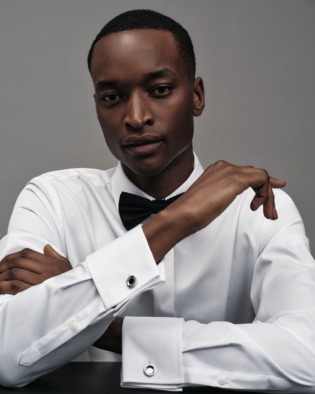 Man in white formal shirt and black bowtie